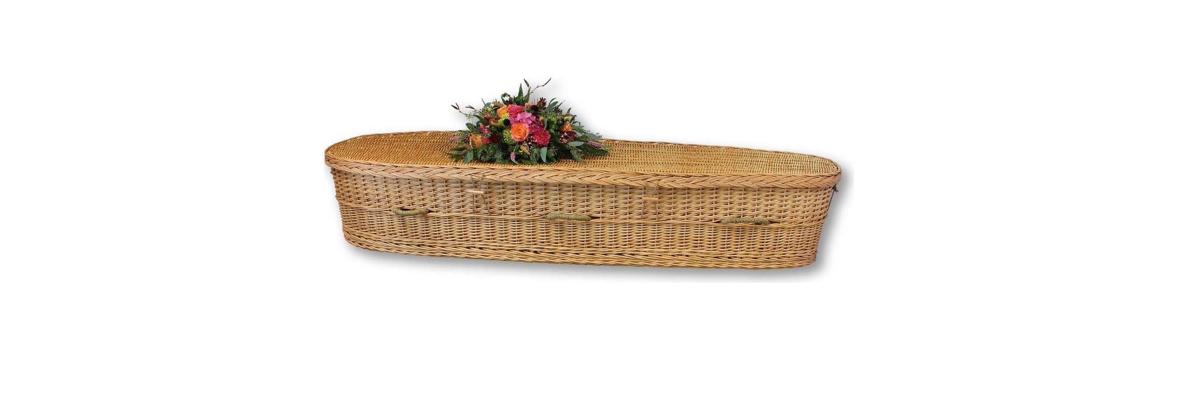Windsor willow casket with a floral arrangement on the lid